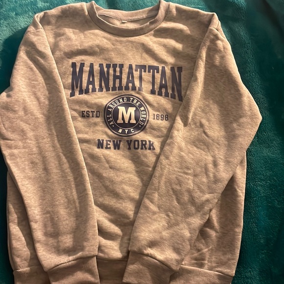 This is a medium sized long sleeve sweatshirt with no hood, from SHEIN. - Picture 1 of 5